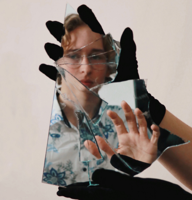 boy with broken mirror